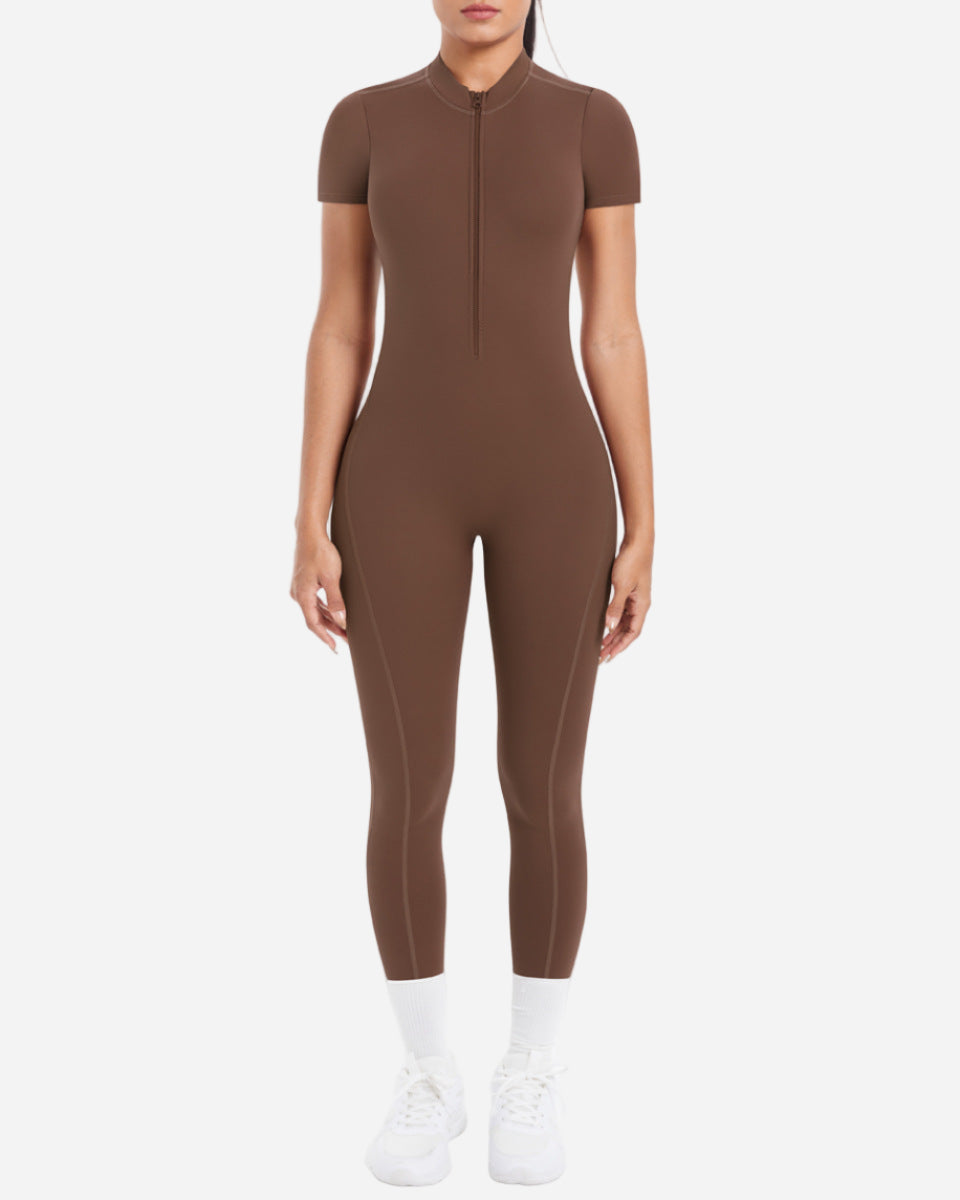 Brown jumpsuit worn by a person on a white background