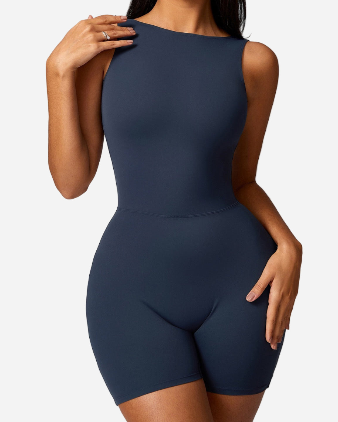 Navy blue bodysuit worn by a model on a light gray background
