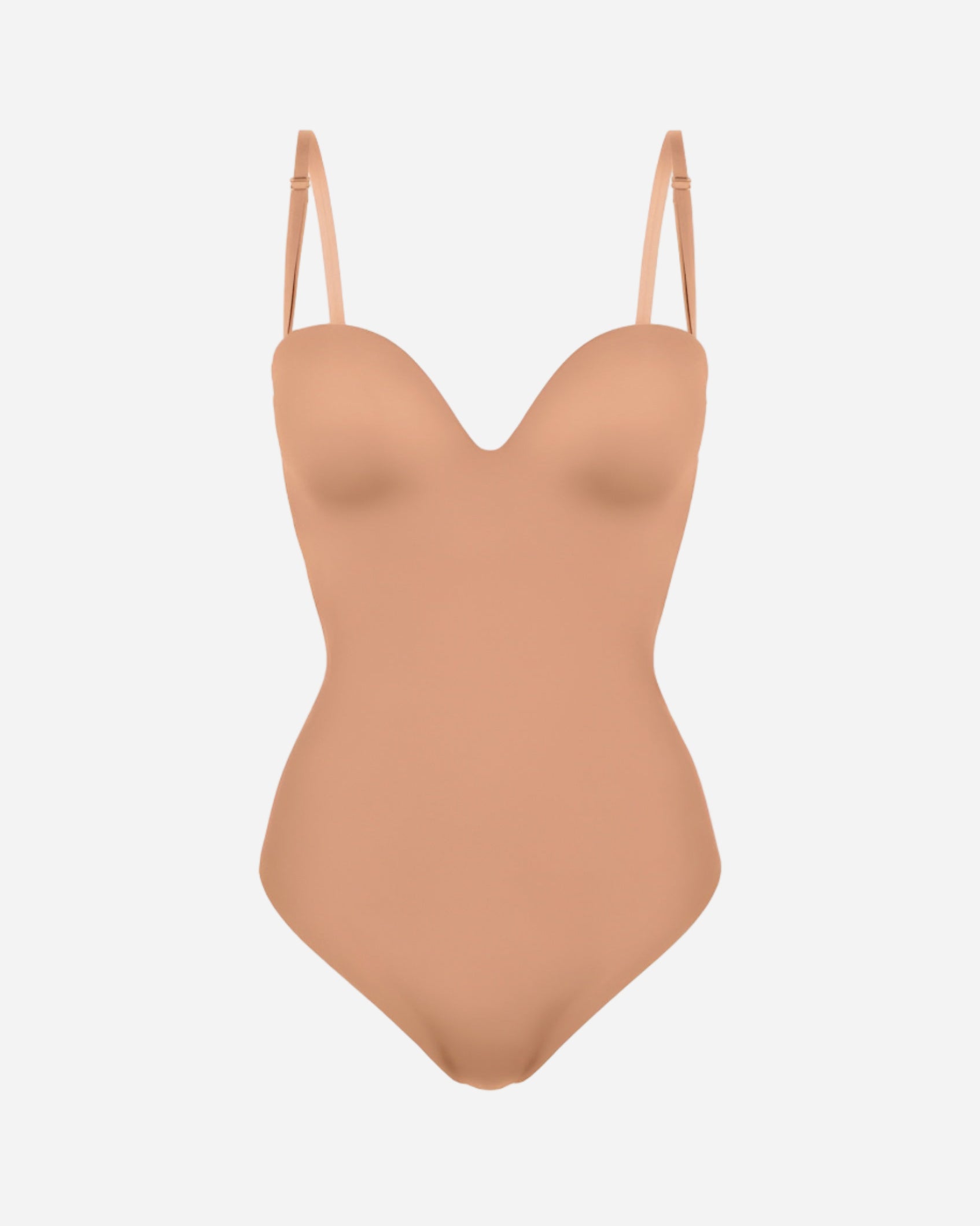 Tan swimsuit with thin straps on a white background